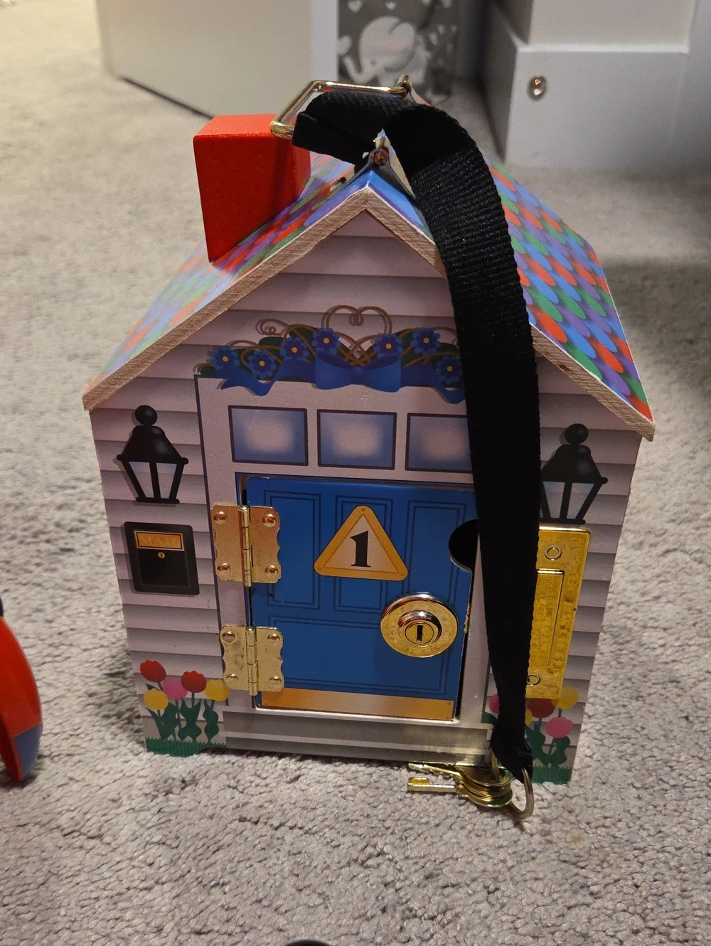 Melissa & Doug Blue Door Wooden Lock Box House with Multicolor Roof